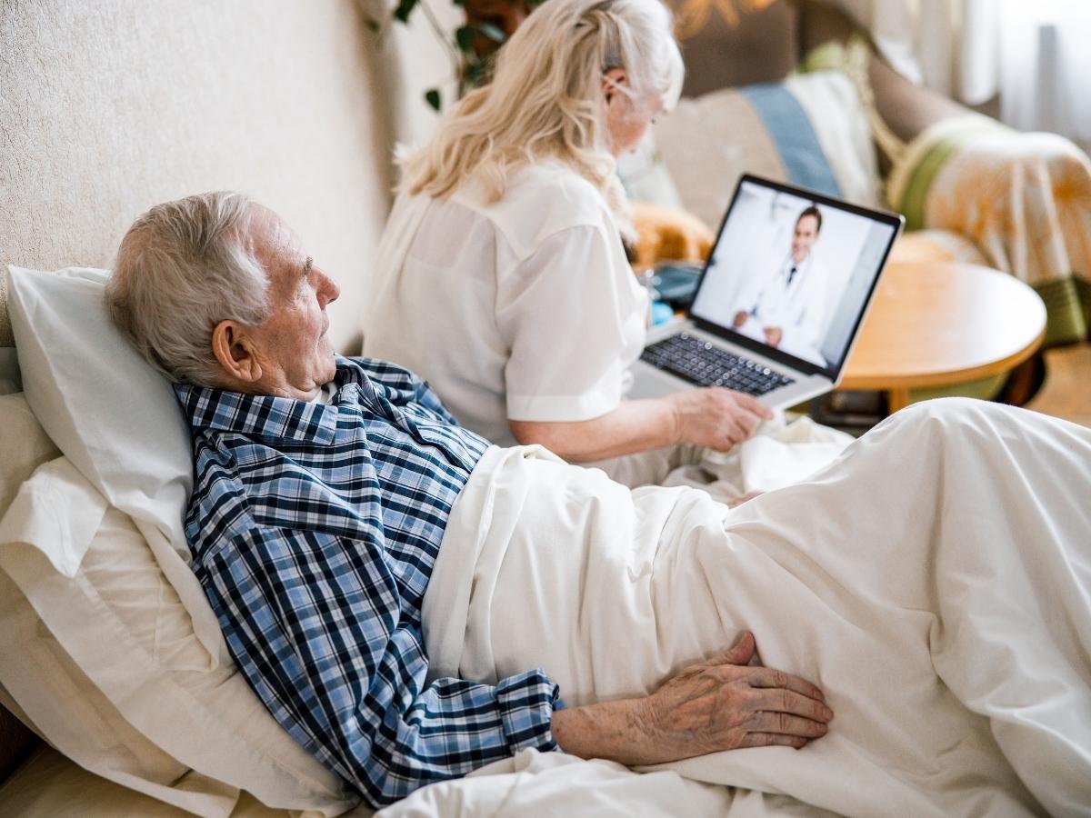 An old man recovers in a hospital after surgery. He didn't have health insurance, but rather belongs to a medical expense sharing program.