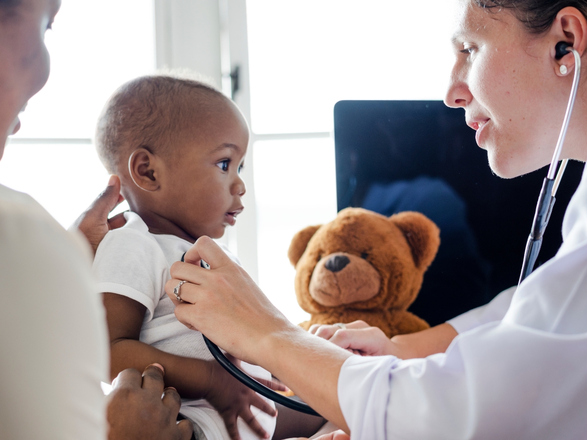 What can you expect from a specialist visit? More hands on care with the issue you're dealing with. Pediatrics is a specialty, a doctor checks a toddler's vitals distracting with a teddy bear.