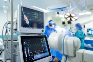 Surgery Care Plans. A hospital room with monitors and medical equipment. A Modern Hospital Room with Advanced Medical Equipment.