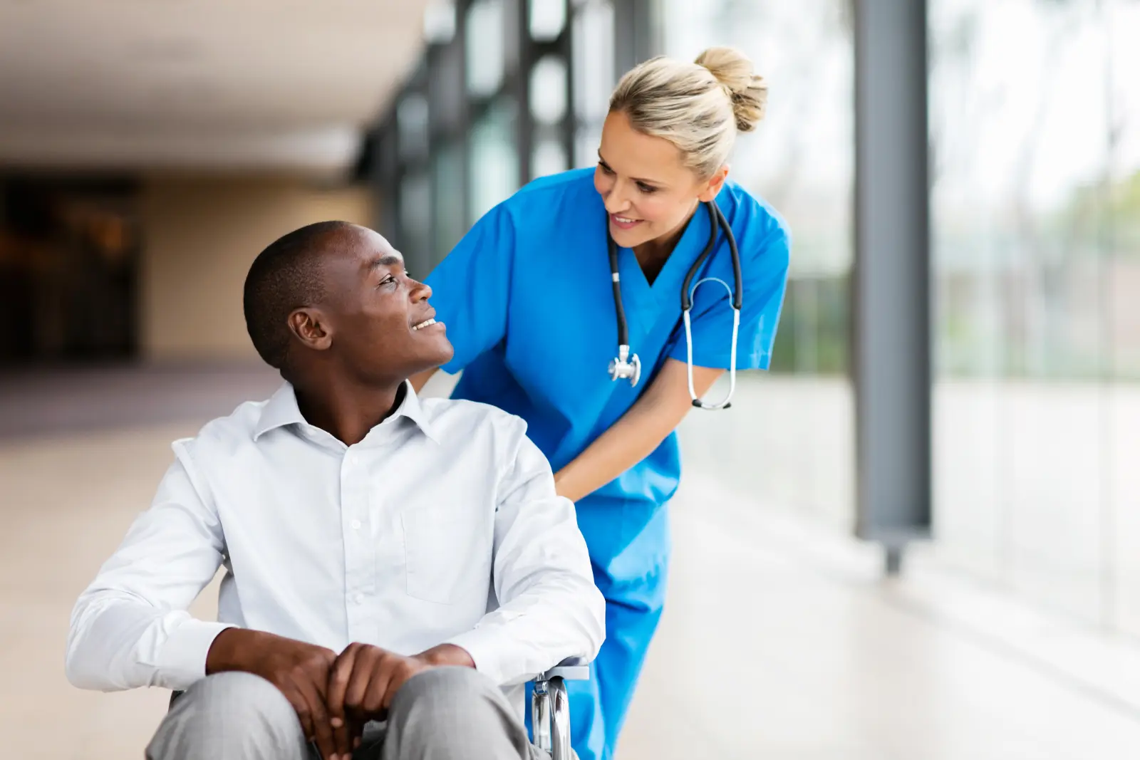 female nurse talking to disabled patient Personalized Medical Plans